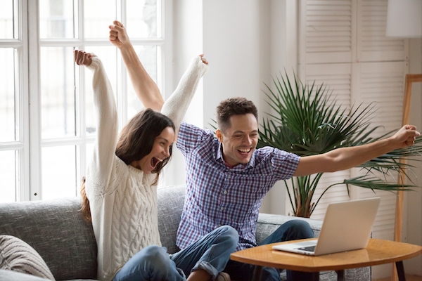 Excited Couple Securing Mortgage